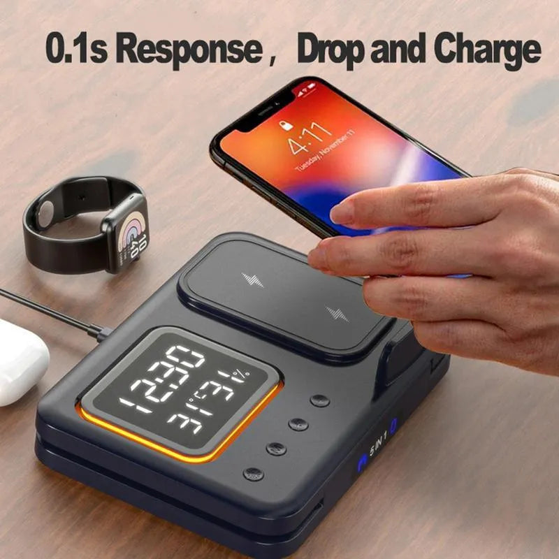 Black wireless charging station with digital display showing time and temperature, charging phone and watch