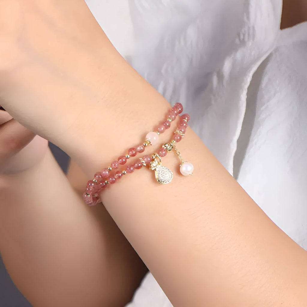 Women's strawberry quartz crystal bracelet with geometric shapes for money drawing