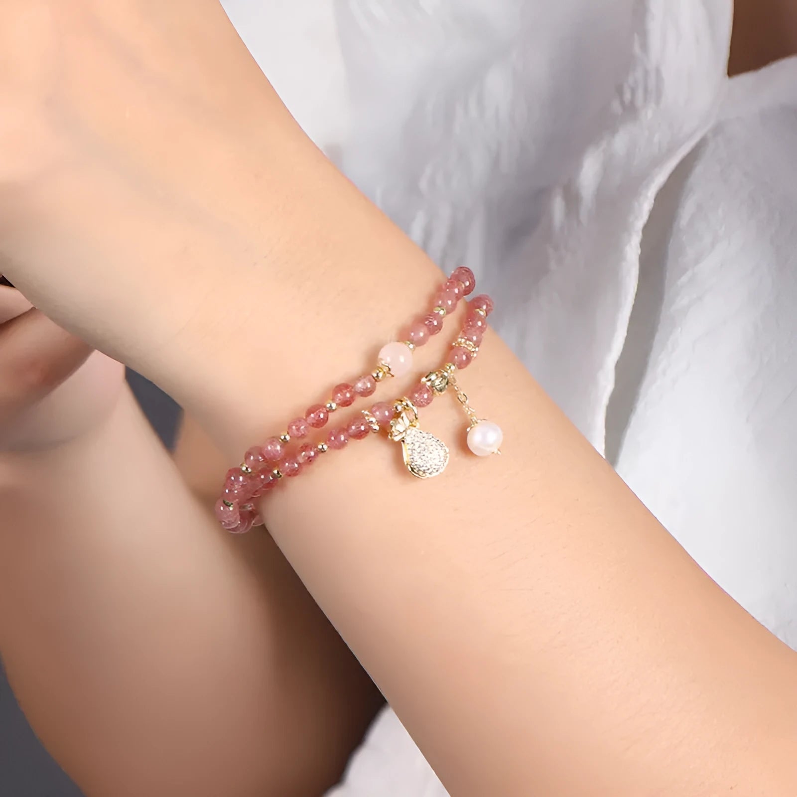 Women's strawberry quartz crystal bracelet with geometric shapes for money drawing