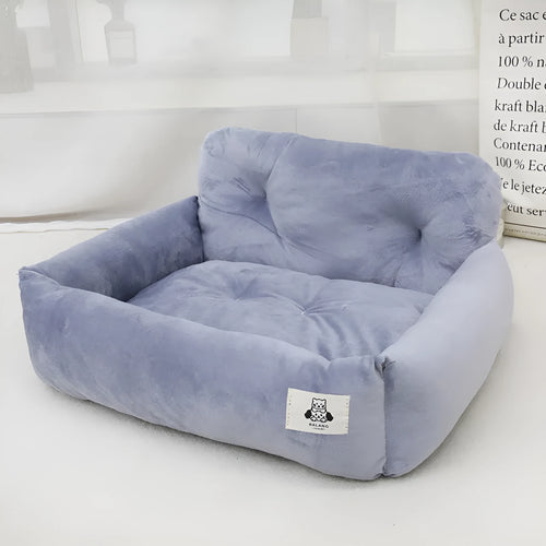 Grey and blue plaid car-mounted dog travel nests showing small and large size options