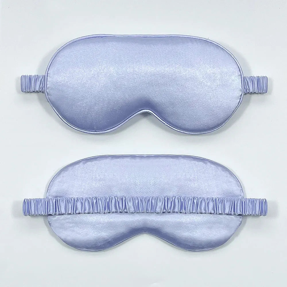 Rayon satin double-sided sleep mask in a selection of solid colours on a white background.