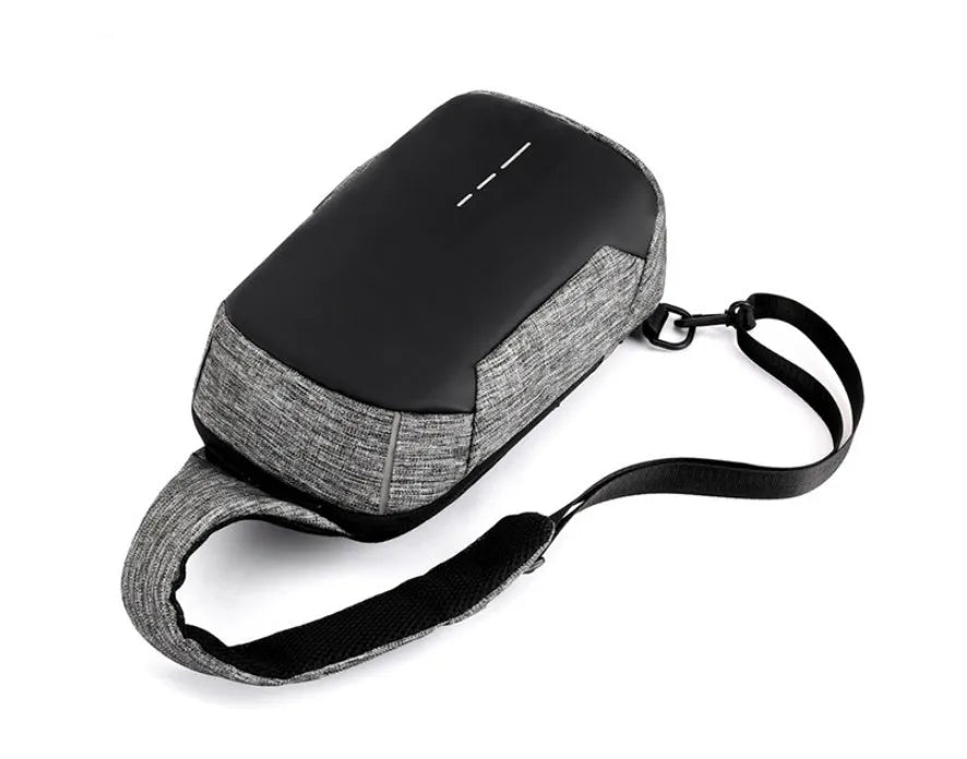 Dark blue waterproof oxford chest bag with adjustable strap, showing front zipper and compact square shape.