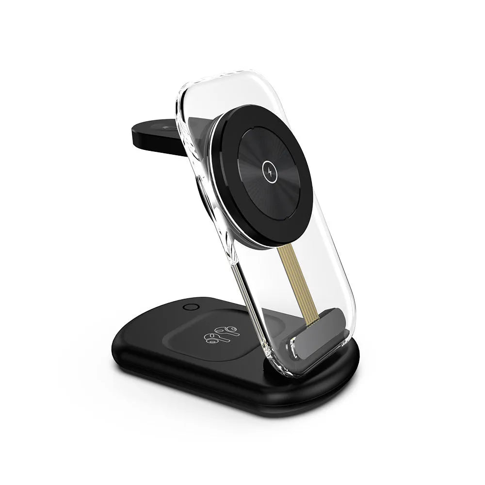 Transparent folding magnetic wireless charger showing internal components, charging an iPhone and AirPods case on a desk.