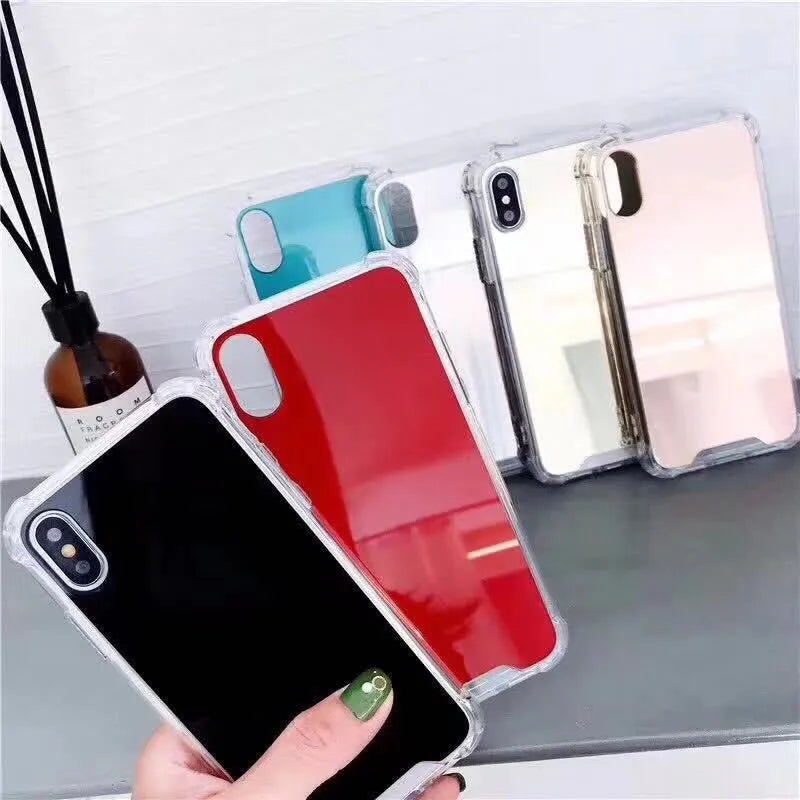 TPU mirror phone case for iPhone on a table, showing anti-fingerprint finish.