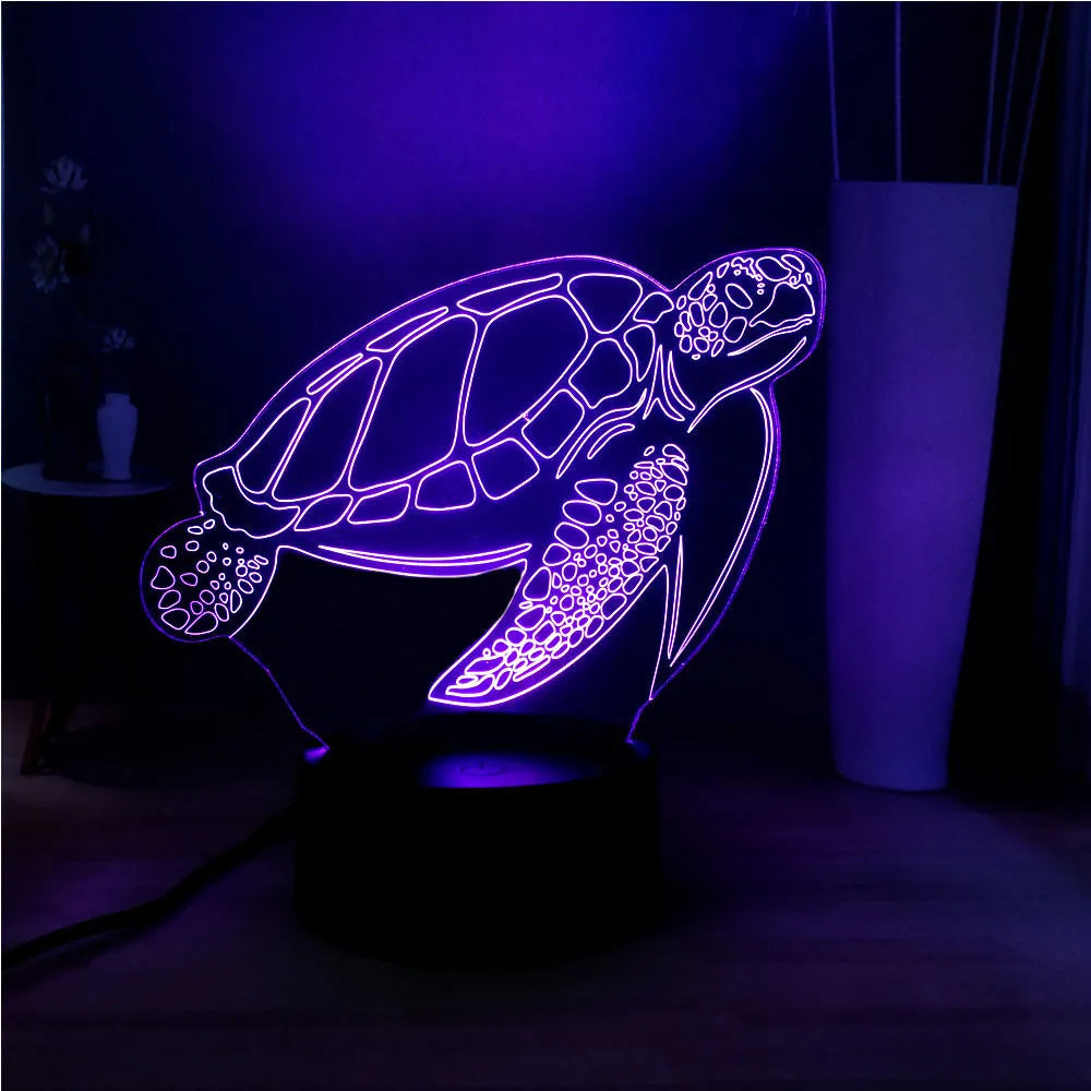 3D acrylic turtle-shaped LED night light with remote control on a shelf.