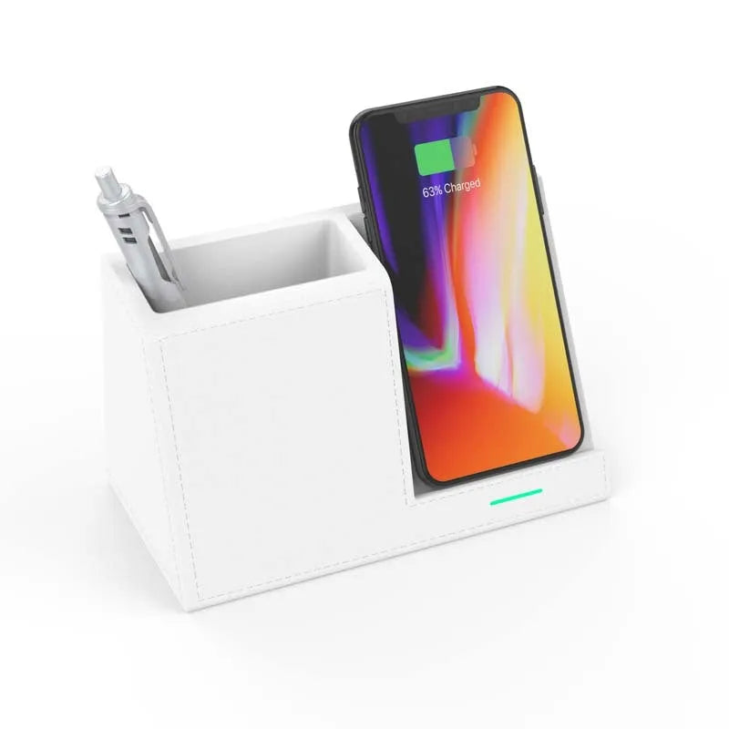 Black leather desk organiser with pen slots and a wireless phone charging pad on top