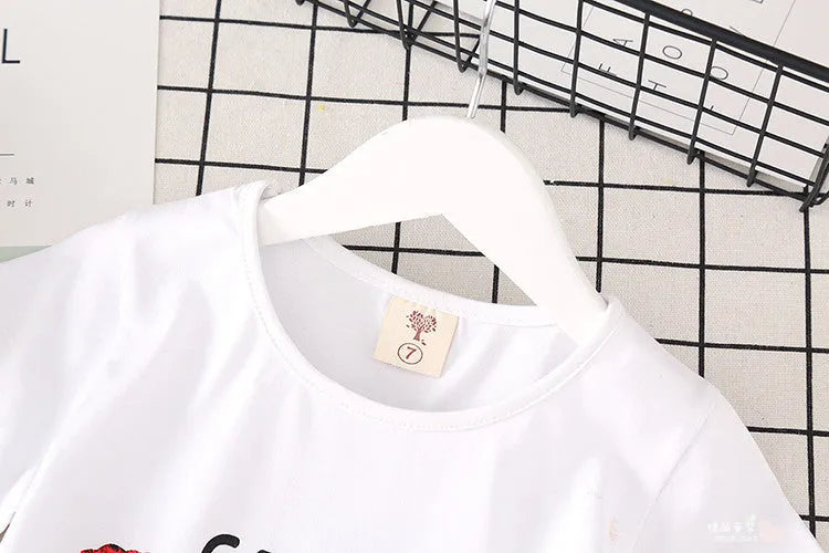 Girls 2 piece outfit with white t-shirt and denim skirt, black or red letters, sizes 100cm to 140cm