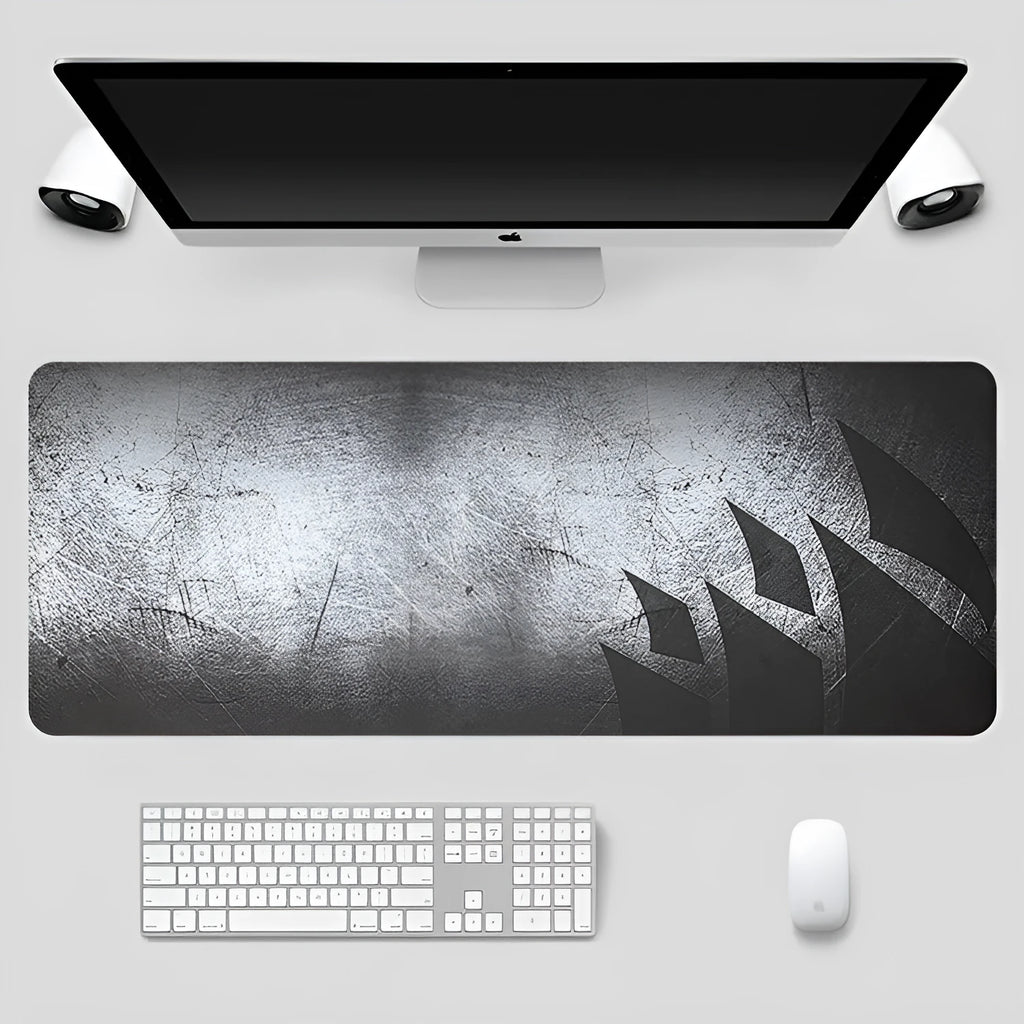 Black thickened non-slip mouse pad with rubber base and cloth surface on a desk