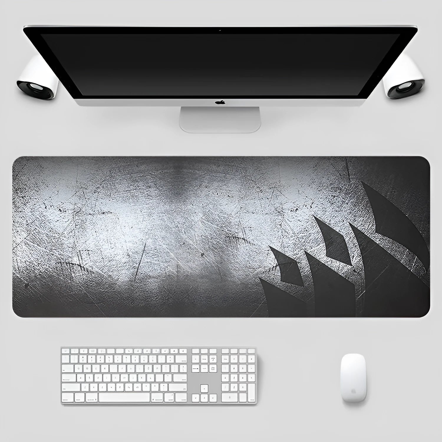 Black thickened non-slip mouse pad with rubber base and cloth surface on a desk