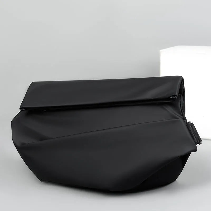 Grey crossbody bag for men showing horizontal square shape, shoulder strap, and zipper opening