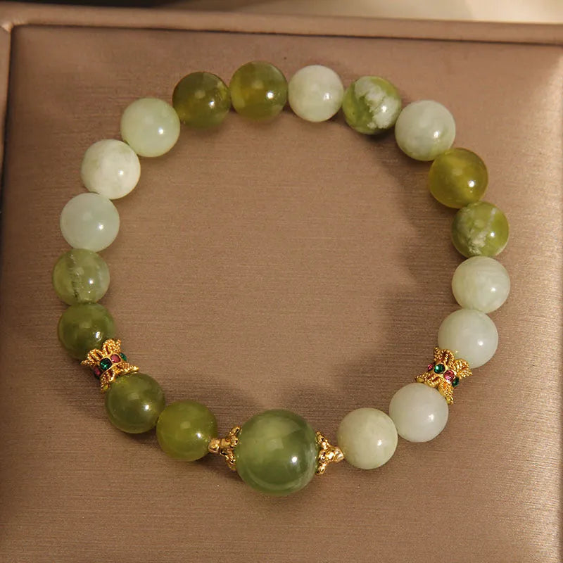 Xiuyan jade green mori-style women's bracelet with original design on a white background.