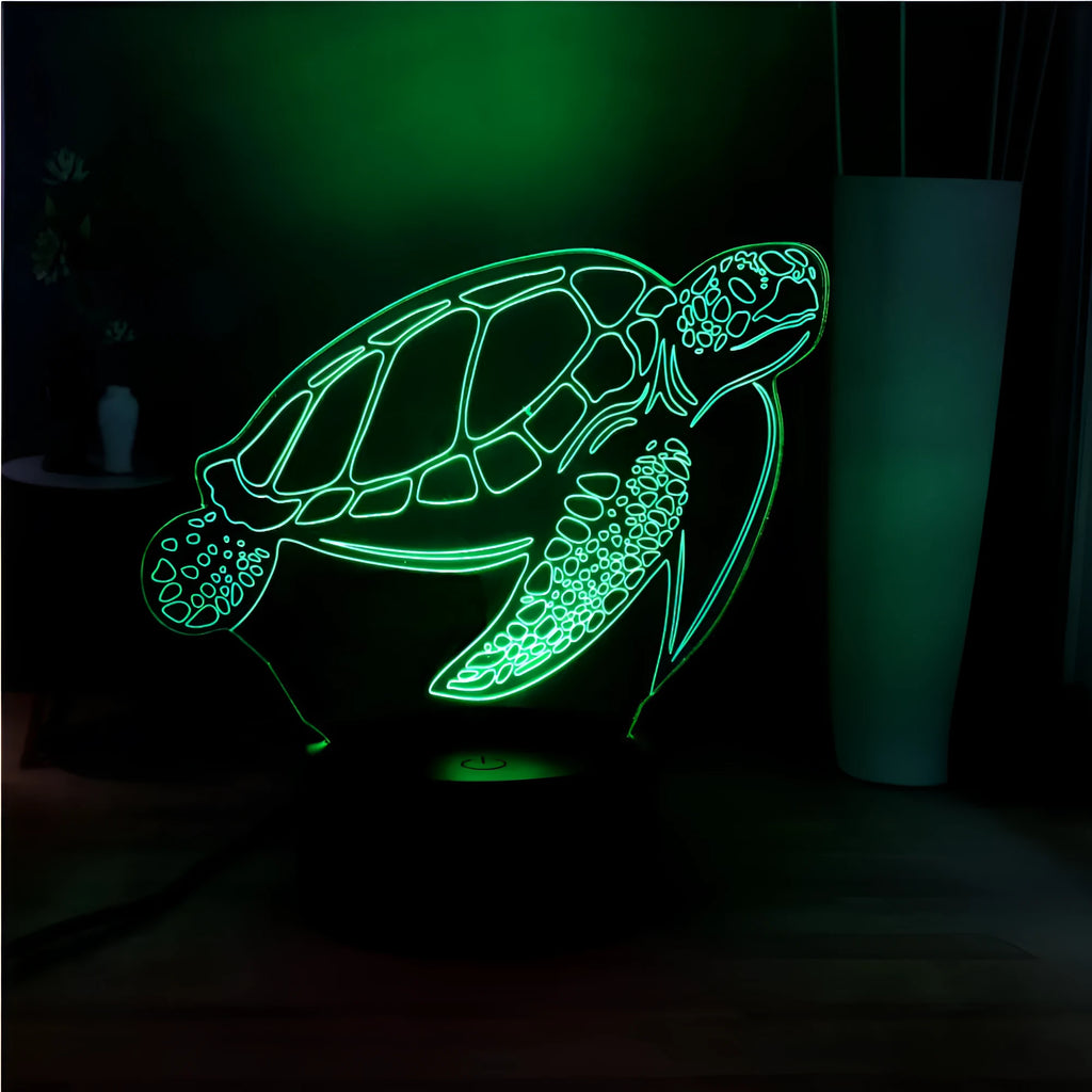 3D acrylic turtle-shaped LED night light with remote control on a shelf.