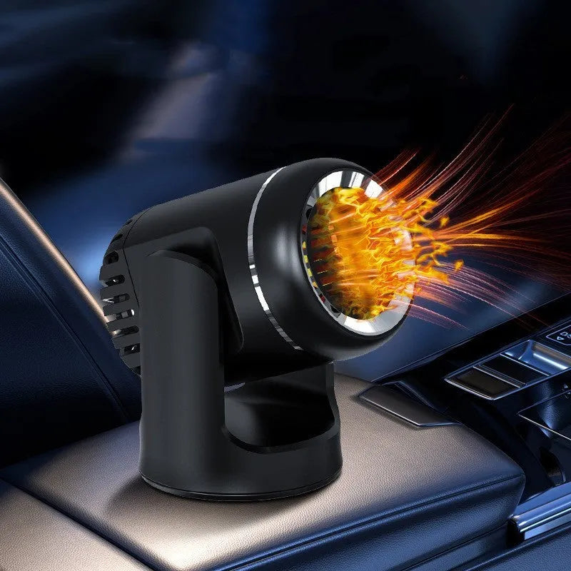 Black and white 12V car heater defroster unit with a long power cord on a car dashboard.