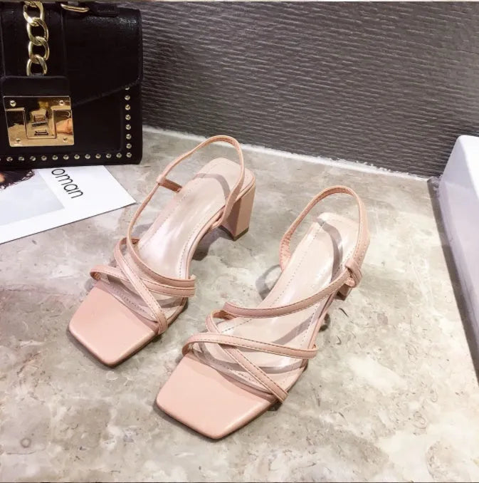 Women's apricot coloured slip-on sandals with a thick chunky heel and open back.