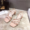 Women's apricot coloured slip-on sandals with a thick chunky heel and open back.