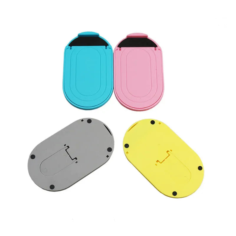 A plastic mobile phone stand with a lazy bracket mechanism shown in one of six colour options.