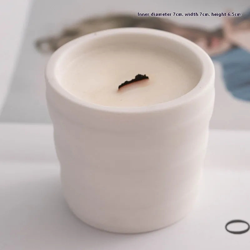 Minimalist ceramic round candlestick with relief pattern on a dining table