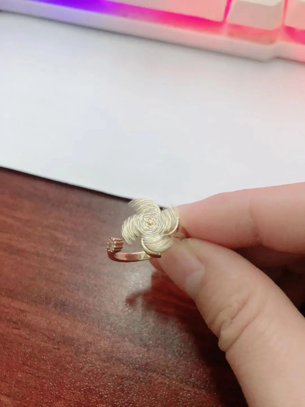 Geometric rotating ring with micro inlaid design in gold or silver colour