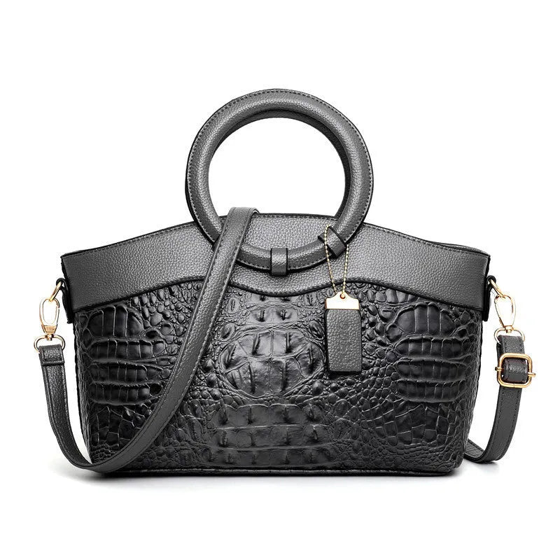 Ladies fashion handbag with shoulder strap showing zipper compartments in multiple colour options
