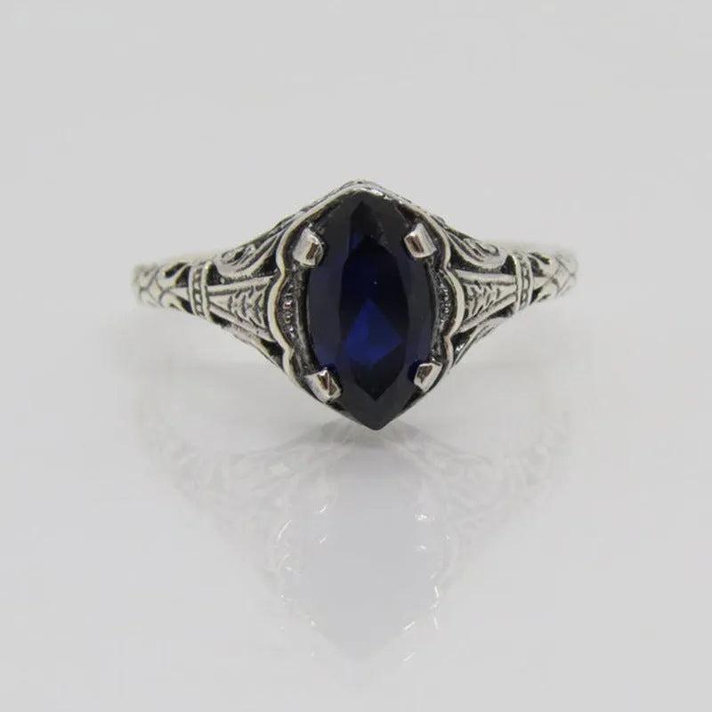 Silver women's geometric hollow alloy ring showing detailed openwork design.