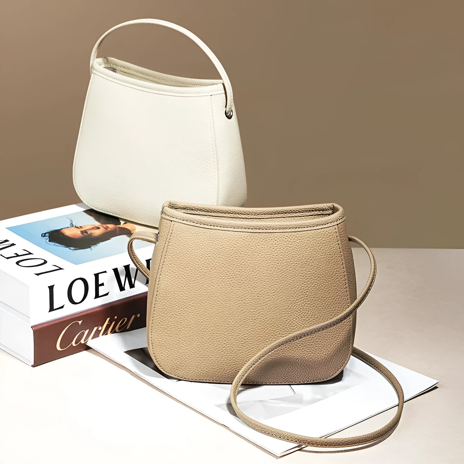 Soft genuine cowhide women's messenger bag in a square vertical shape with a loading handle.