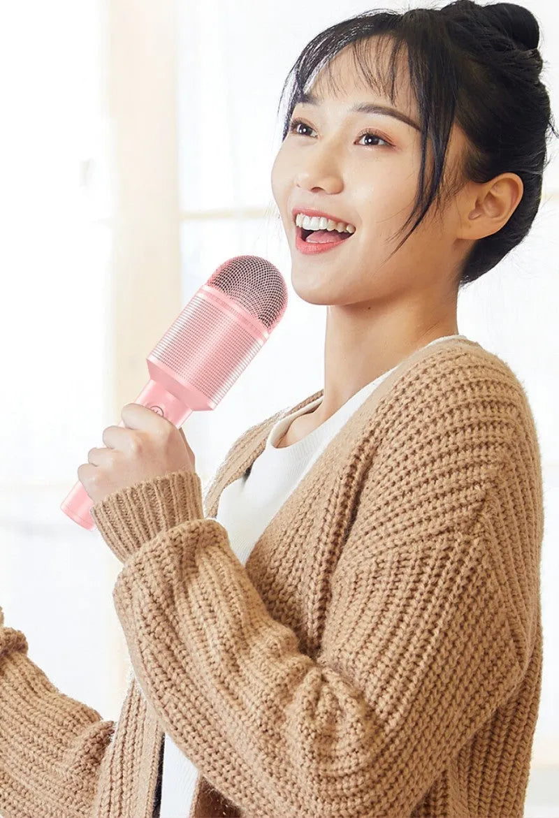 Wireless Bluetooth karaoke microphone in pink, blue, or green with USB connection