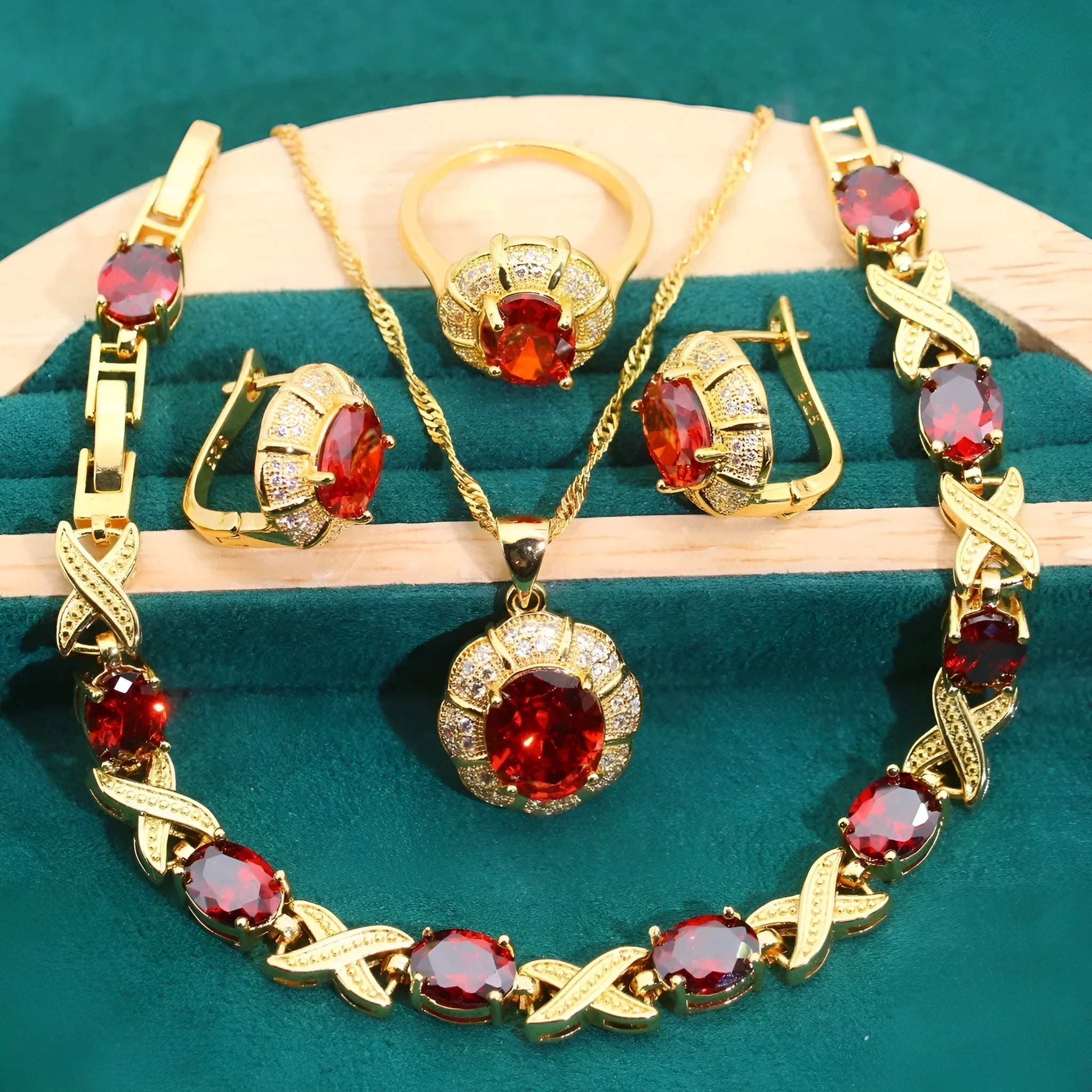18k gold-plated necklace, bracelet, earrings, and ring set with blue cubic zirconia stones.