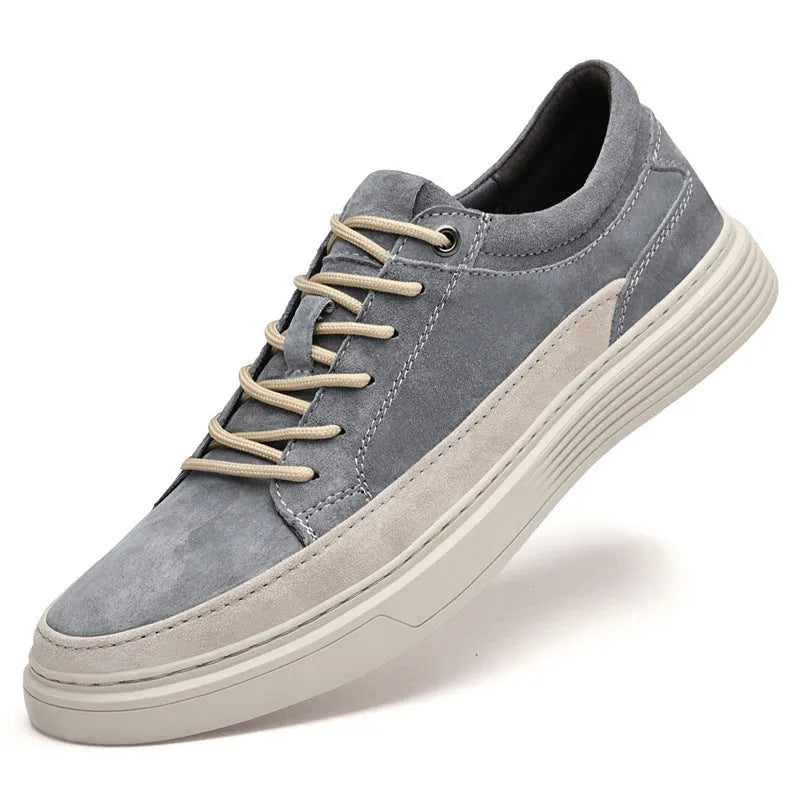 Men's gray casual skate shoes with pigskin upper and rubber sole on a white background.