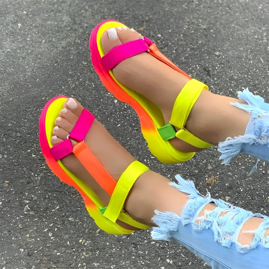 Fish mouth sandals with artificial leather upper, flat heel, and belt buckle fastening, shown in black