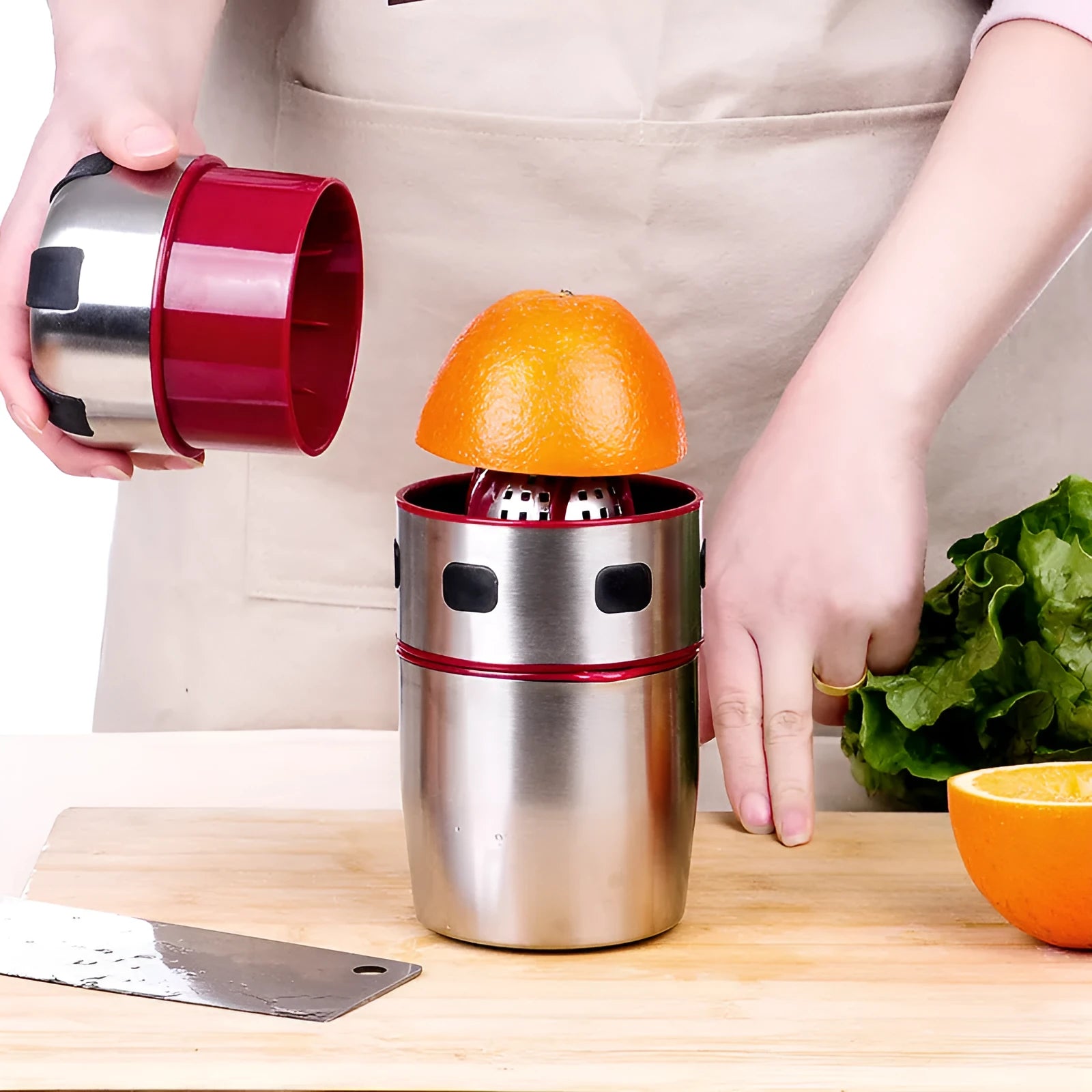 Manual stainless steel citrus juicer with 304 filter and press handle on a kitchen counter