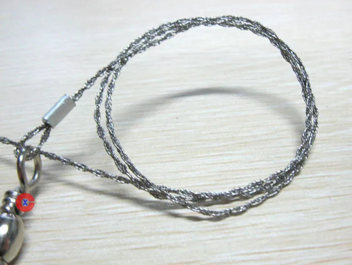 Stainless steel survival wire saw with ring attachments showing 55cm cutting length