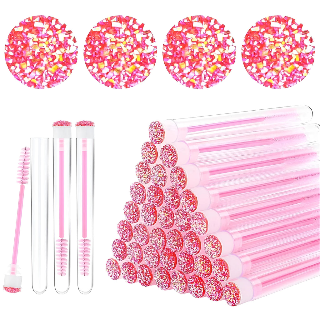 Disposable eyelash mascara brushes in transparent storage tubes showing blue, green, pink and purple colour options