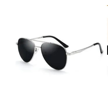Retro classic vintage sunglasses with gold frame and black grey TAC polarised lenses on a white background