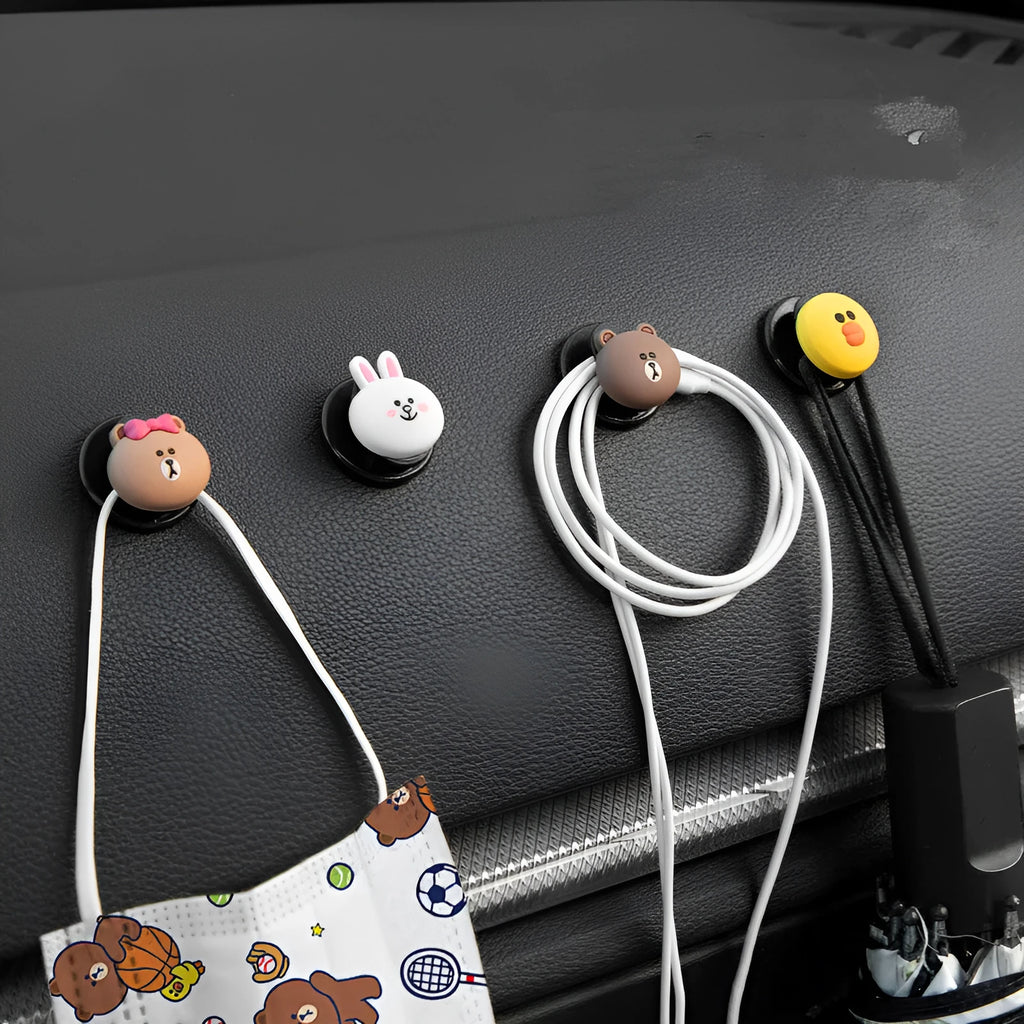 Small cartoon car interior hook with adhesive backing, PVC body and rounded silicone shape, shown in BROWN style.