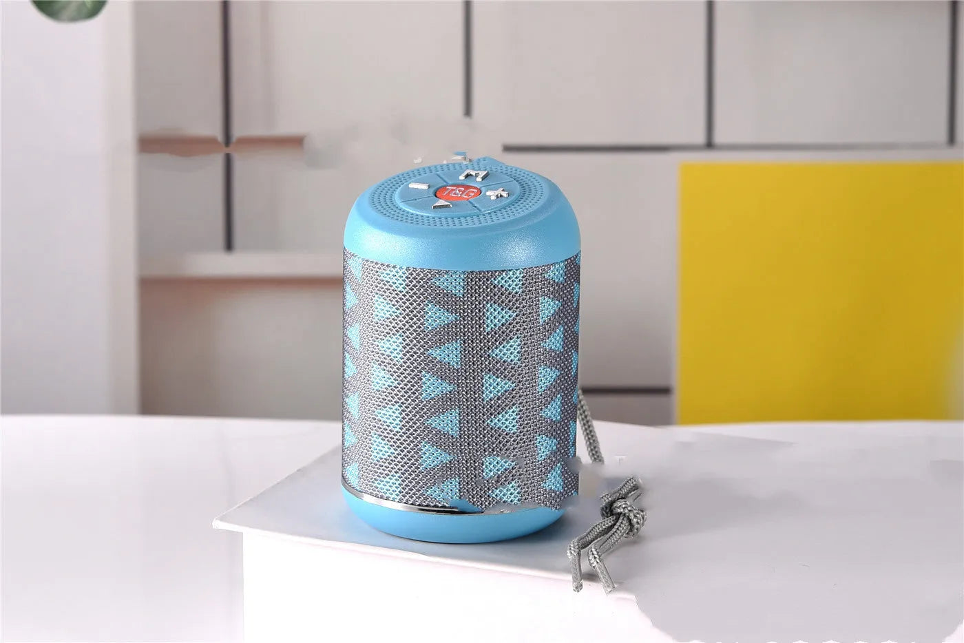 Portable outdoor Bluetooth subwoofer speaker in multiple colour options showing button controls.