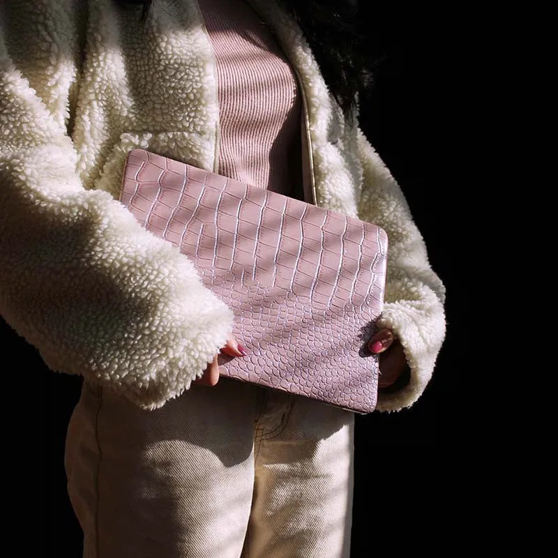 Pink MacBook protective case with bubble pattern and colourful stickers, compatible with 11-inch to 16-inch models.