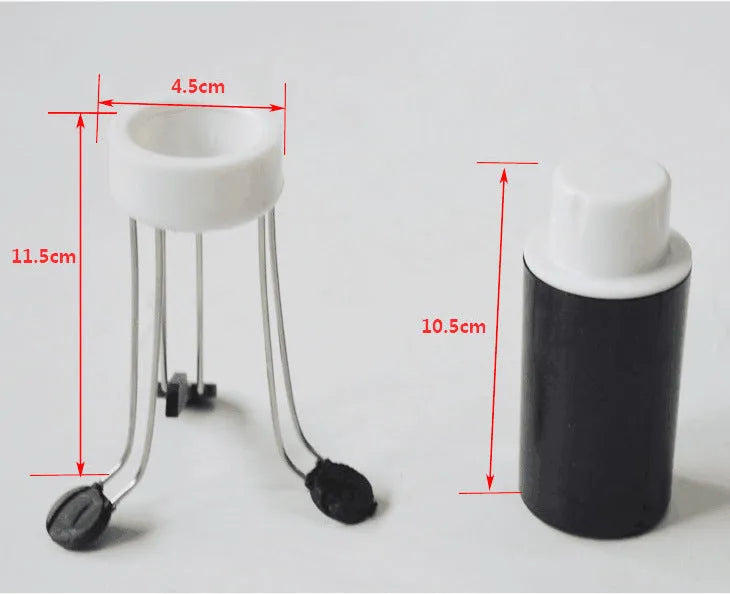 White and black wireless automatic blender with stainless steel stirring arms on kitchen counter