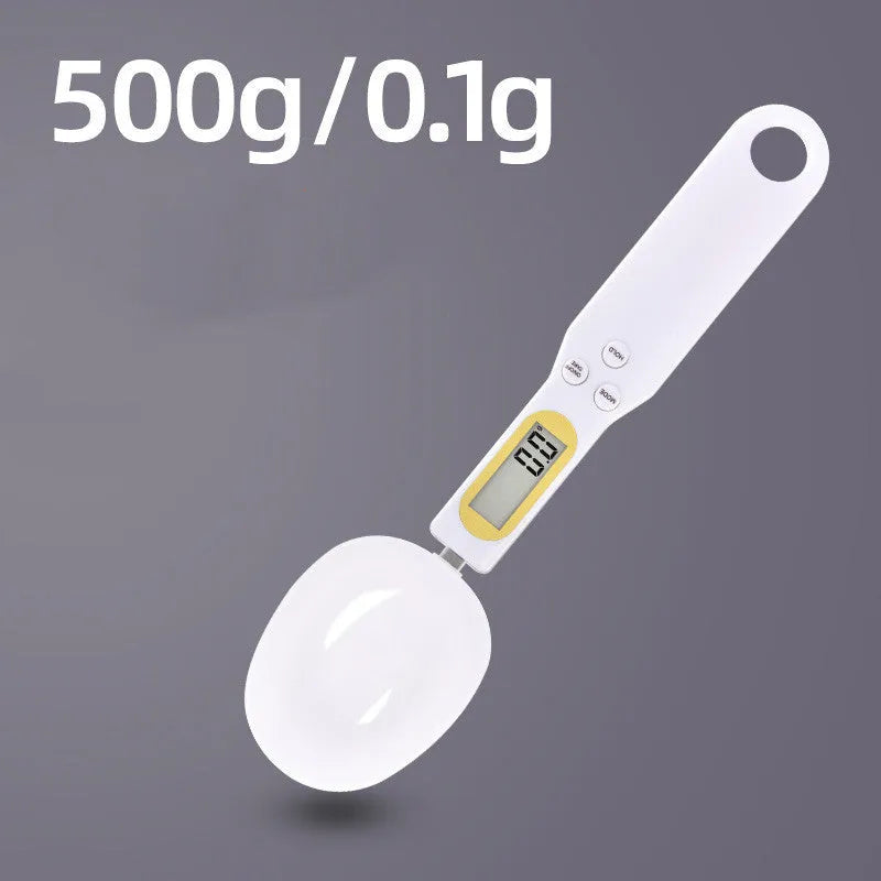 Black electronic measuring spoon scale with digital display showing weight measurement