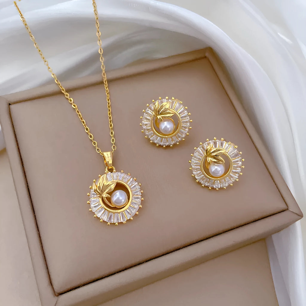 Women's titanium steel necklace and earrings set with square diamond ring pendant and leaf design.