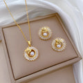 Women's titanium steel necklace and earrings set with square diamond ring pendant and leaf design.