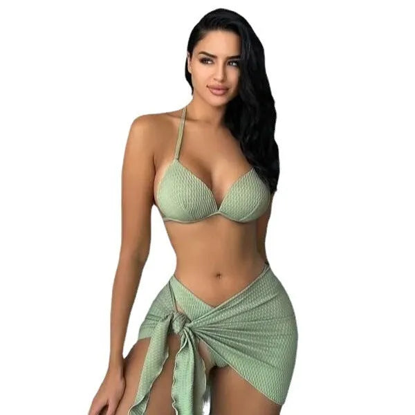 Women's sexy Russian three-piece swimsuit set in a solid colour, showing top, skirt, and panties.