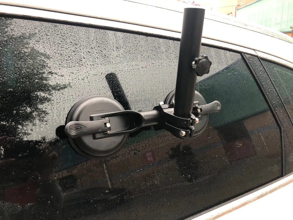 Black off-road car glass sucker base with round rubber disc for windscreen mounting.