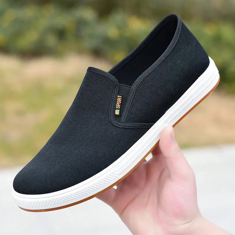 Men's black slip-on canvas cloth shoes with round toe and shallow mouth design