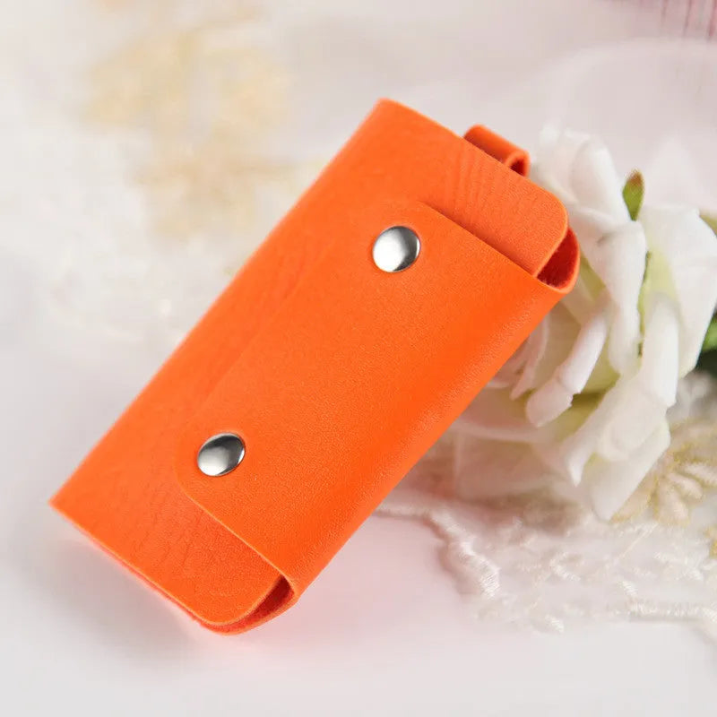 Colourful button closure PU leather key case in square vertical shape with soft plain finish