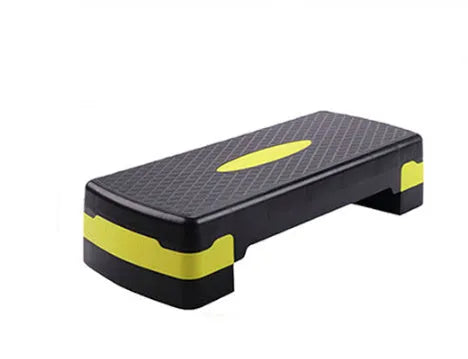 Grey Fit Step aerobic exercise platform on a home floor.