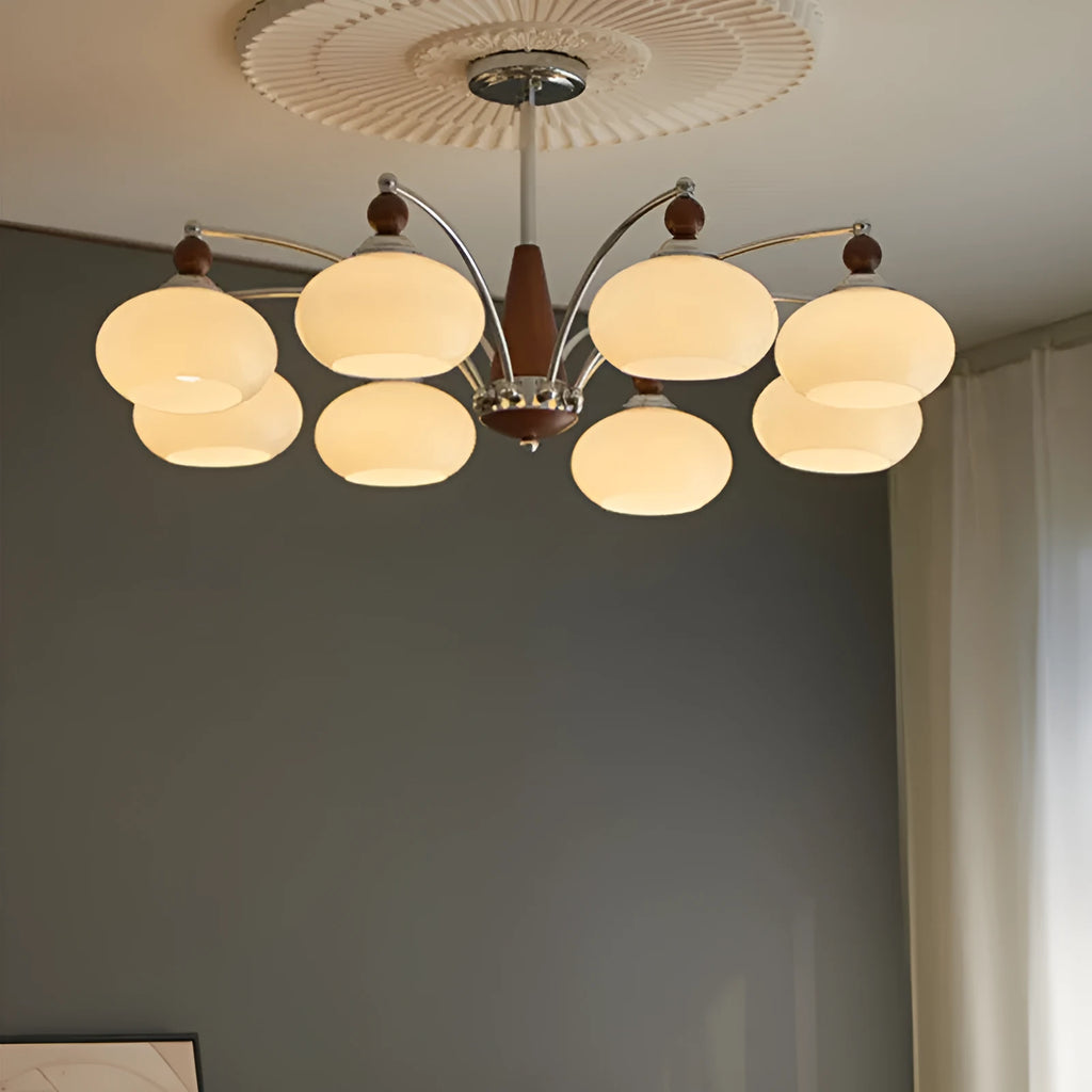Persimmon glass chandelier with multiple chrome lampshades in a Middle Ancient style, hung from a ceiling.