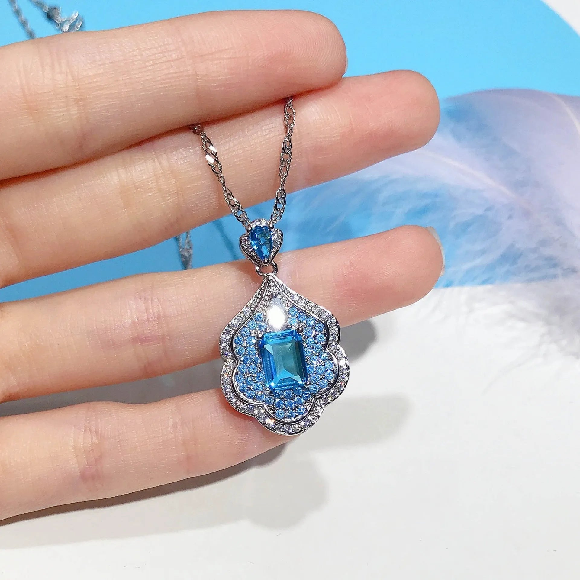 Sea blue geometric copper pendant with aquamarine topaz mirror finish