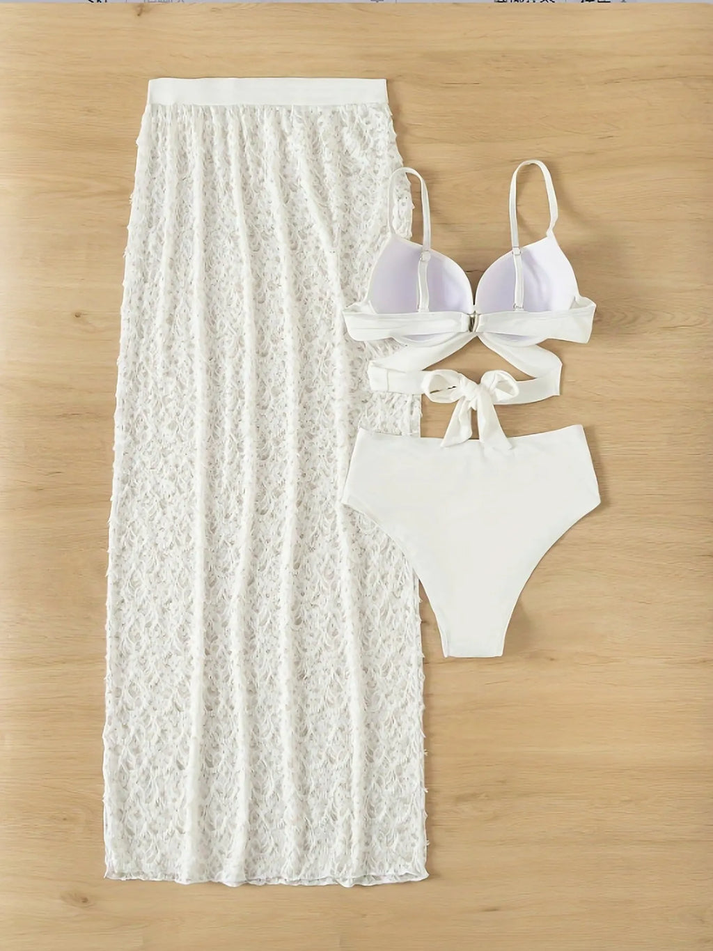 White three-piece swimsuit with long gathered skirt, sleeveless top, and briefs for swimming sports