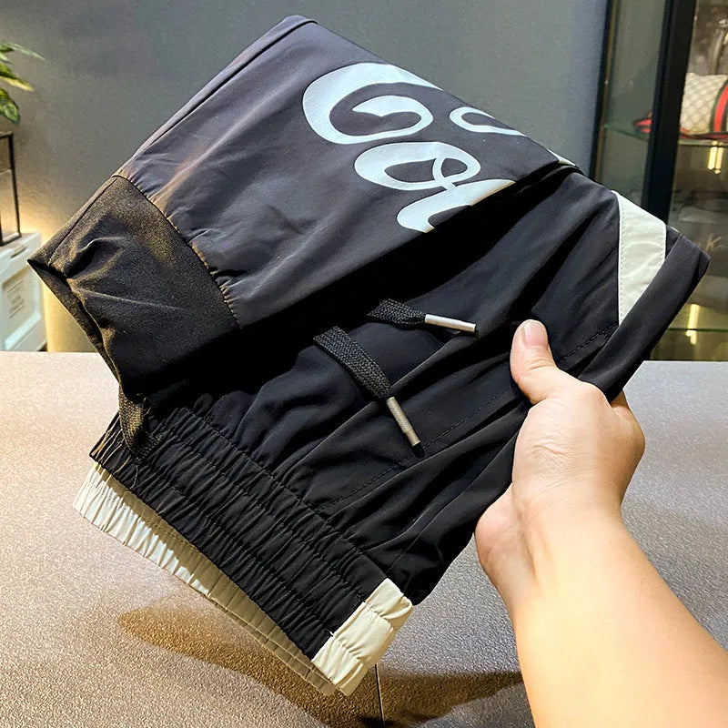 Black men's cropped casual trousers with ankle banding made from ultra-thin ice silk and cotton.
