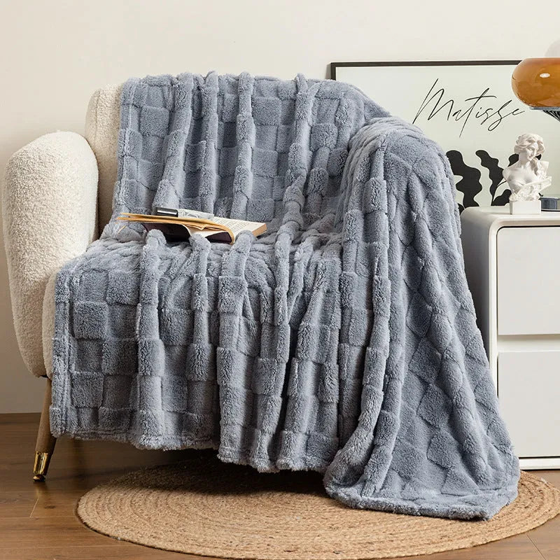 Geometric pattern polyester blanket in lake blue colour showing thickened texture